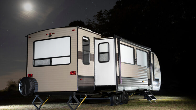 Night-time picture of an RV with slide-out.